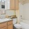 a bathroom with a tub sink and toilet