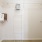 a white wall with a metal rack